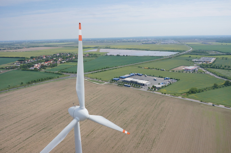 Aerial image of a wind power plant and a solar power plant
